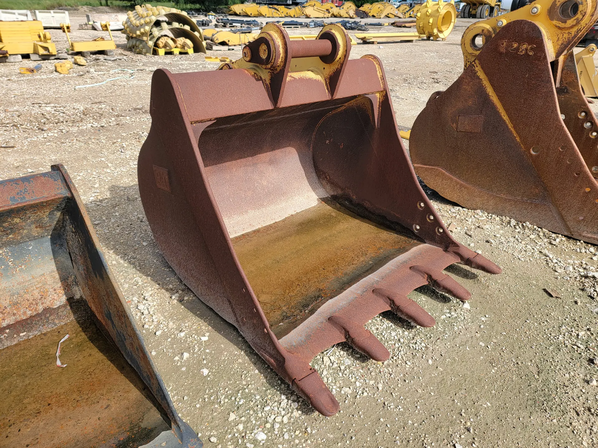 USED 54" CB BUCKET WORN BASE EDGE BETWEEN TEETH     MQ image 1
